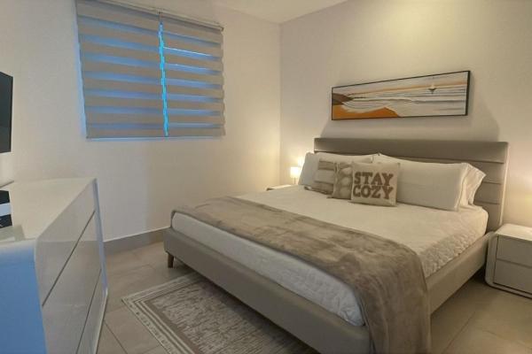 Apartamento moderno de 2 habitaciones frente al mar en playa malibú