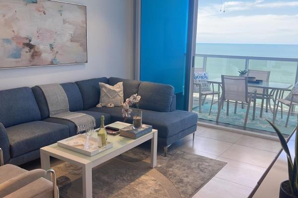 Apartamento moderno de 2 habitaciones frente al mar en playa malibú