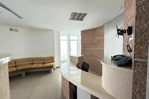 Bank sells office in bmw center building