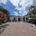 Golf palm trees 525,000 neg near serene beach
