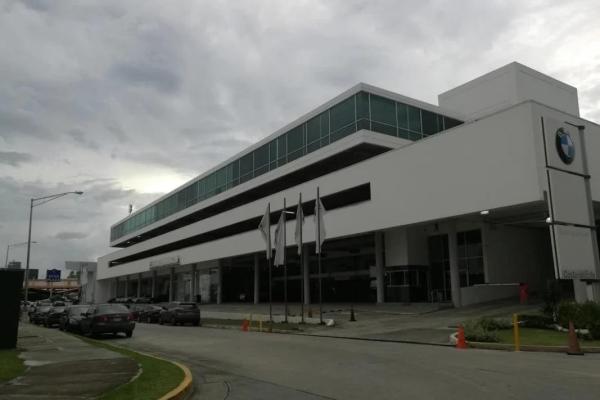 Bank sells office in bmw center building