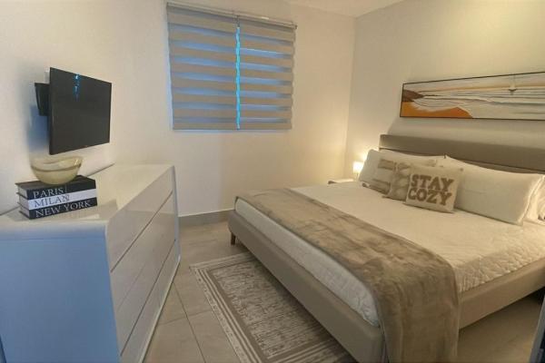 Apartamento moderno de 2 habitaciones frente al mar en playa malibú